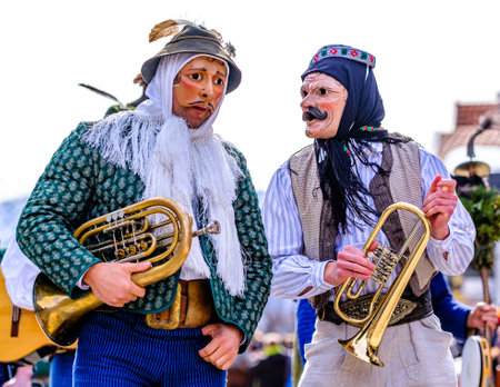 Mittenwald, Germany - February 24: Participants of a parade with traditional historic costumes to drive out the winter called 'maschkera' in Mittenwald on February 24, 2022のeditorial素材