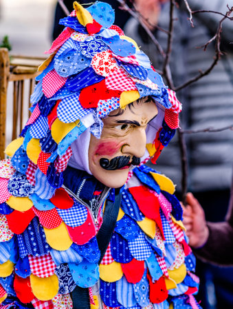 Mittenwald, Germany - February 24: Participants of a parade with traditional historic costumes to...