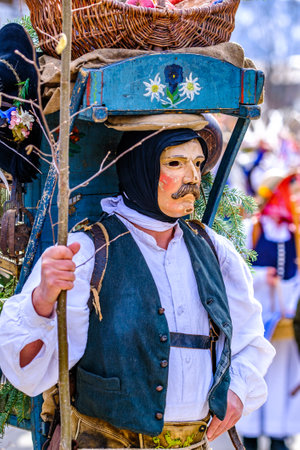 Mittenwald, Germany - February 24: Participants of a parade with traditional historic costumes to drive out the winter called 'maschkera' in Mittenwald on February 24, 2022のeditorial素材