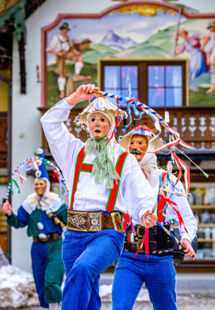 Mittenwald, Germany - February 24: Participants of a parade with traditional historic costumes to drive out the winter called 'maschkera' in Mittenwald on February 24, 2022のeditorial素材