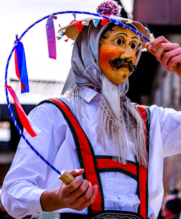 Mittenwald, Germany - February 24: Participants of a parade with traditional historic costumes to...