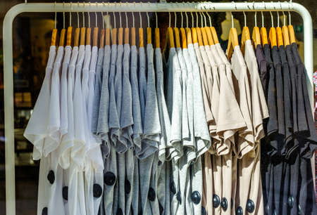 clothes hanging at a clothes rail - photoの写真素材