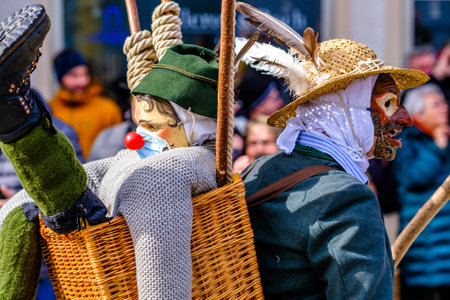 Mittenwald, Germany - February 24: Participants of a parade with traditional historic costumes to drive out the winter called 'maschkera' in Mittenwald on February 24, 2022のeditorial素材