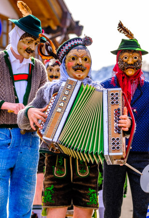 Mittenwald, Germany - February 24: Participants of a parade with traditional historic costumes to drive out the winter called 'maschkera' in Mittenwald on February 24, 2022のeditorial素材