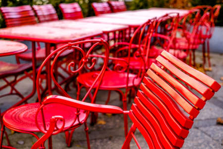 table and chairs at a sidewalk cafe - photoの写真素材