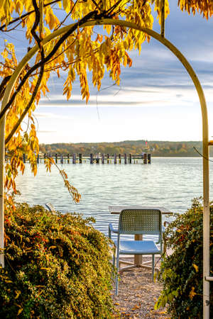 table and chairs at a sidewalk cafe - photoの写真素材