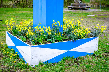 typical maypole in bavaria with the bavarian coat of arms - germanyの写真素材