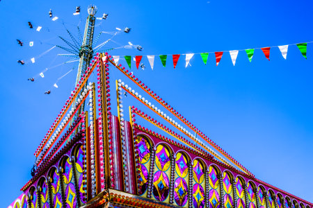 Munich, Germany - April 27: typical rides, ferries wheel, roller coaster at the annual spring festival (Fruhllingsfest) in munich on April 27, 2022のeditorial素材