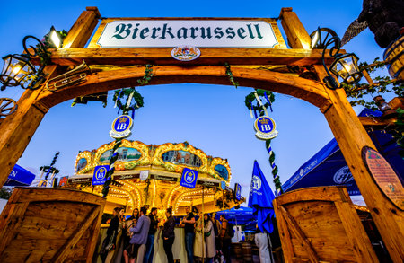 Munich, Germany - April 27: visitors, typical amusement parks rides and stands at the annual spring festival (Fruhllingsfest) in Munich on April 27, 2022のeditorial素材