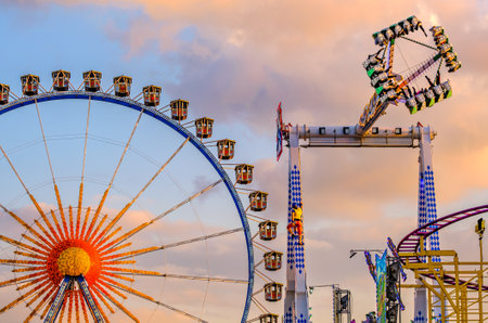 Munich, Germany - April 27: typical rides, ferries wheel, roller coaster at the annual spring festival (Fruhllingsfest) in munich on April 27, 2022のeditorial素材