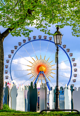 Munich, Germany - April 27: memorial for the oktoberfest attack in 1980 in the background the spring festival in munich on April 27, 2022のeditorial素材