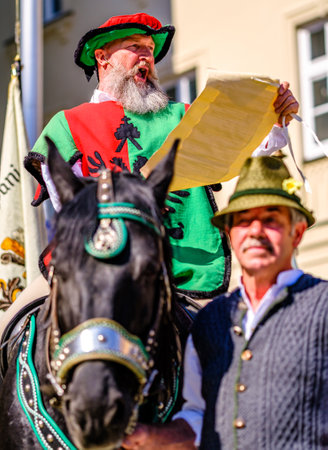Freising, Germany - April 28: participants in a parade on "the beer day" with historical costumes in the old town of Freising on April 28, 2022のeditorial素材