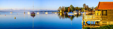 old jetty and sailboats in tutzing - bavaria - germany