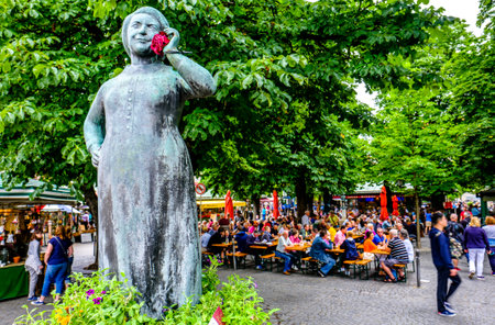Munich, Germany - July 11: famous statue on a well at the munich viktualienmarkt on July 11, 2019のeditorial素材