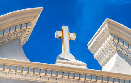 beautiful old cross at a cemetery - photoの写真素材