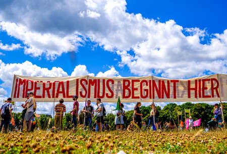 Munich, Germany - June 25: Banners and participants at a demonstration against the G7 meeting in...