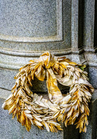 old wreath ornament at a historic statue - photoの写真素材