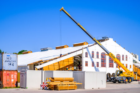 Munich, Germany - July 22: building up the annual worlds largest folk festival oktoberfest (wiesn) with big beerhalls on the theresienwiese in munich on July 22, 2022のeditorial素材