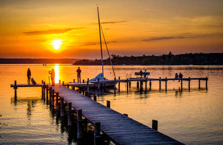 old wooden jetty at a bavarian lake - photoの写真素材