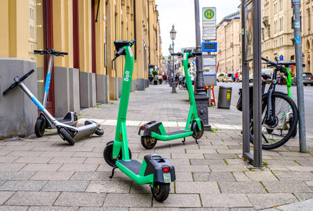 Munich, Germany - June 5: typical modern eScooters at a street in the old town of Munich on June 5, 2022のeditorial素材