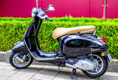 Siena, Italy - July 4:typical italian Vespa Motorscooter (build from Piaggio) at a street in Siena on July 4, 2022のeditorial素材