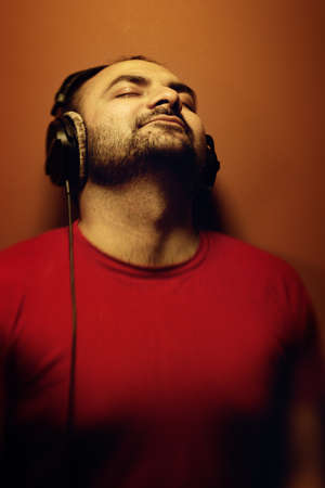 Man listening to music on headphonesの写真素材