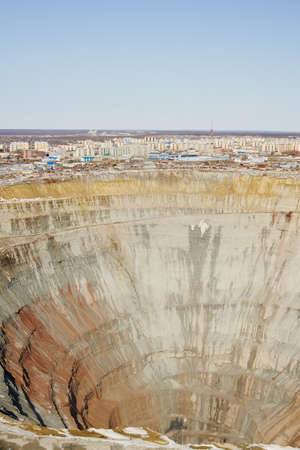 City on the brink of an open-cast mine の写真素材