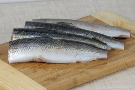 Fish without Ð³Ð»Ð¾Ð²Ñ‹ and a tail prepared for application in a dish. 