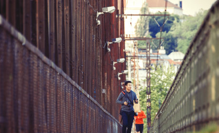 An Unidentified Man Walking the Train Bridgeのeditorial素材