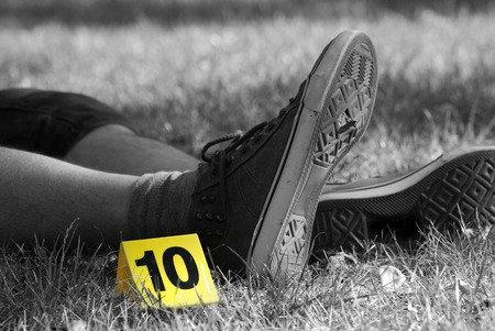 Crime Scene Evidence Marker Next to Legsの写真素材