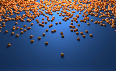 Small Orange Balls Sliding along the Blue Surfaceの写真素材