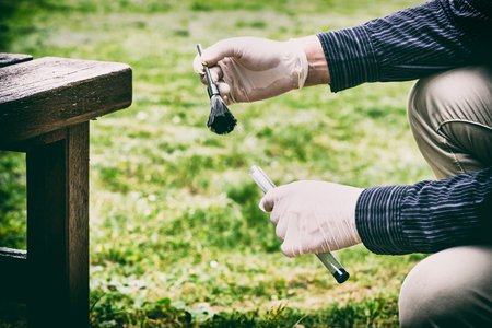 Crime scene investigation, using of dactyloscopic brush to reveal fingerprintsの写真素材