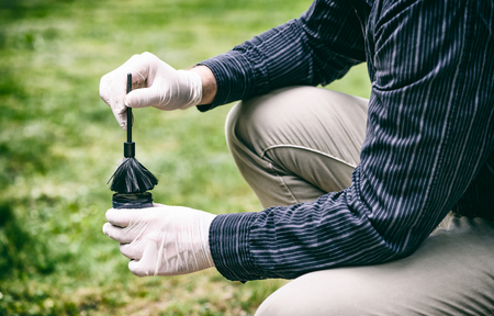 Crime scene investigation, using of dactyloscopic brush to reveal fingerprintsの写真素材