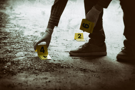 Putting the crime scene markers on the groundの写真素材