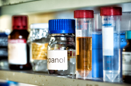 Plastic test tubes filled with chemicals, backgroundの写真素材