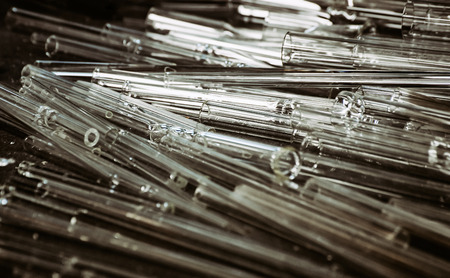 Empty test tubes on the deskの写真素材