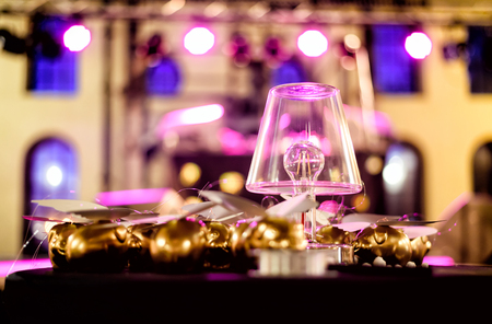 Lamps with LED bulb on the desk, gold decorations behind the lamp