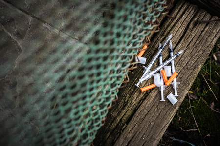 Isolated dropped insuline injections on wooden beam