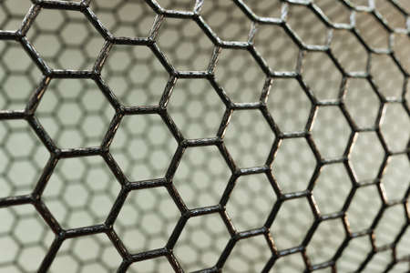 3D rendering of carbon nanotube on dark background, black atoms and bondsの写真素材