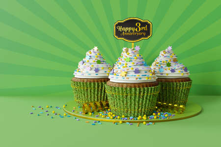3d rendering of cupcakes on a marble plate, text Happy 3rd Anniversary on a topper, green backgroundの写真素材