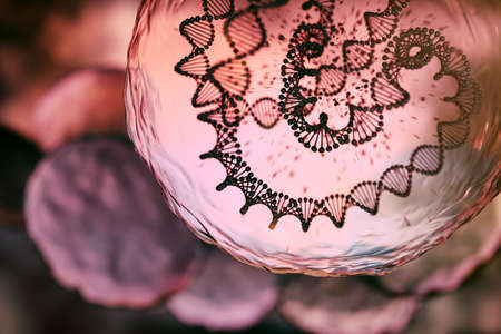 3D rendering of DNA helix closed in water layer, dark orange / red backgroundの写真素材