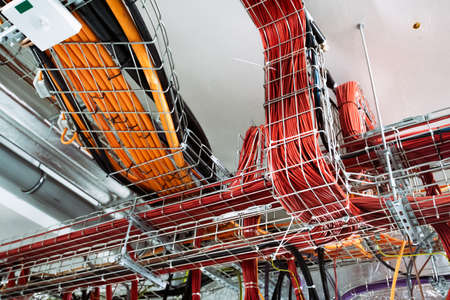 Electrical conduits system and metal pipeline installed on building ceiling.の写真素材