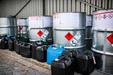 The storage of toxic waste and chemicals in metal cans on the factory premises of a chemical plant / Toxic waste chemical plantの写真素材