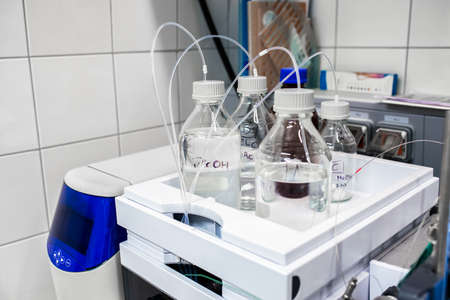 Stock solutions for a purpose of liquid chromatography analysis, bottles are connected directly to the machineの写真素材