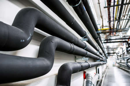 Laying of engineering networks. Ventilation pipes. Air conditioning of buildings. Pipe installation. Technical floor. Maintenance of cable networks.の写真素材