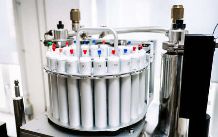 Autosampler of NMR spectrometer loaded with samples for analysis, scientific research background