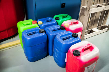 Barrels with chemicals in a chemical warehouse, colored containers, waste managementの写真素材