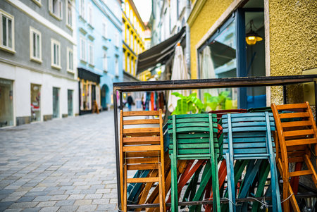 Colorful empty chairs at a restaurant in Salzburg, concept of leisure, relaxationの写真素材