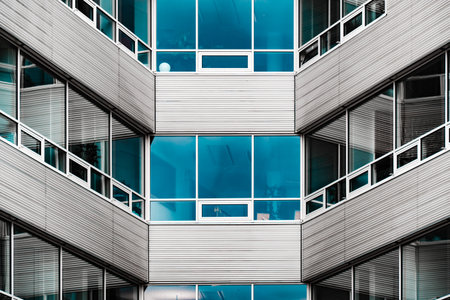 Modern Geometric Facade with Glass and Metal Louversの写真素材