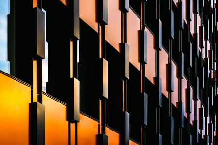 Vibrant Modern Facade with Geometric Patterns and Reflective Windowsの写真素材